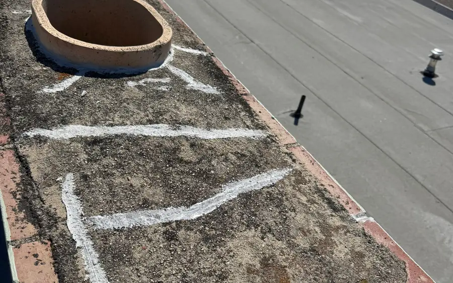 Rooftop chimney flue termination on a flat roof